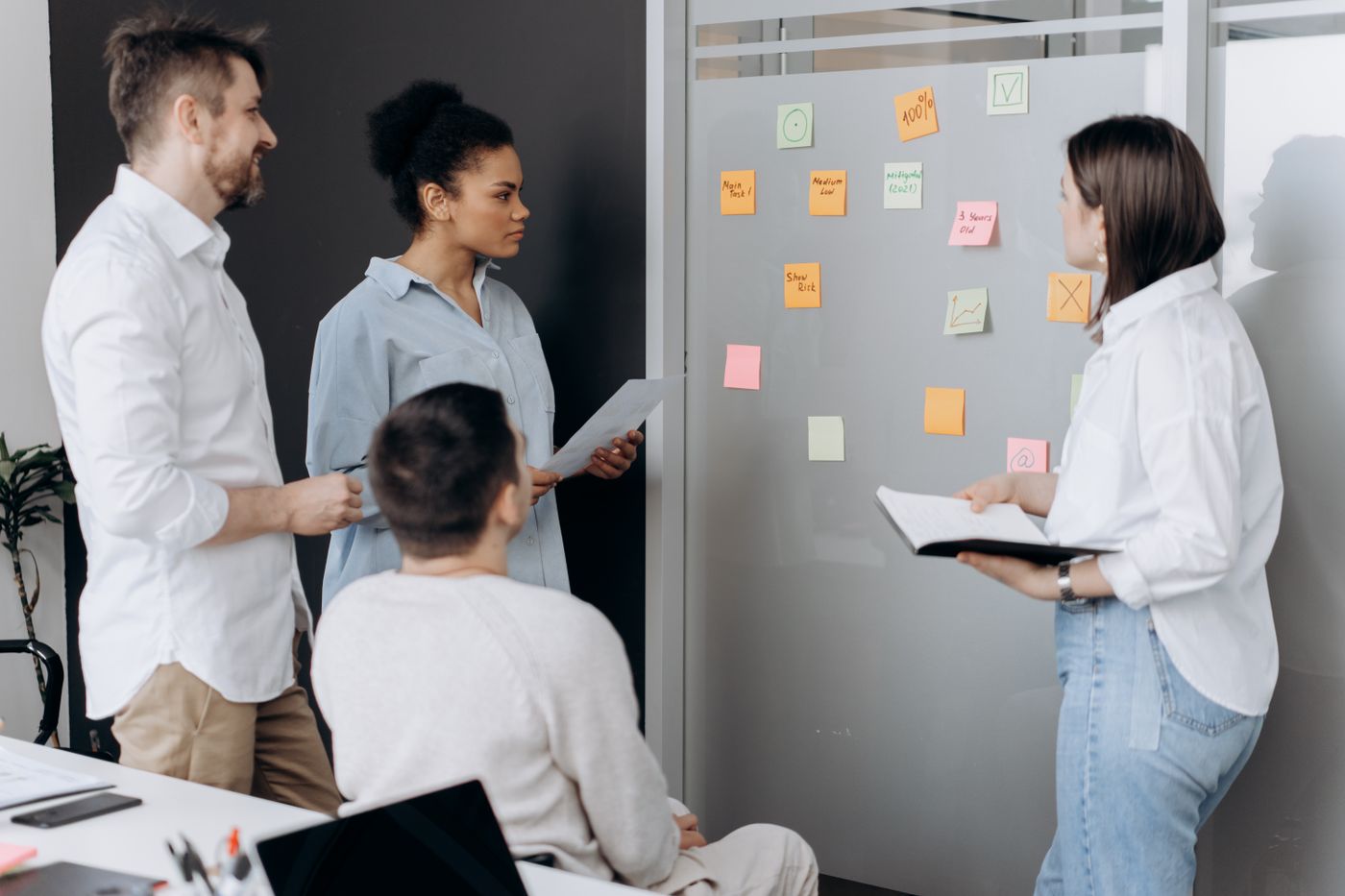 Team planning a coordinated benefit experience with sticky notes